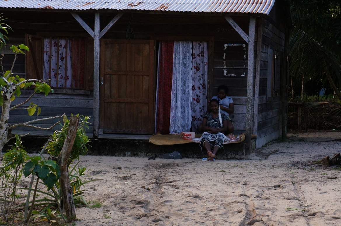 Maroantsetra - woman on steps of house