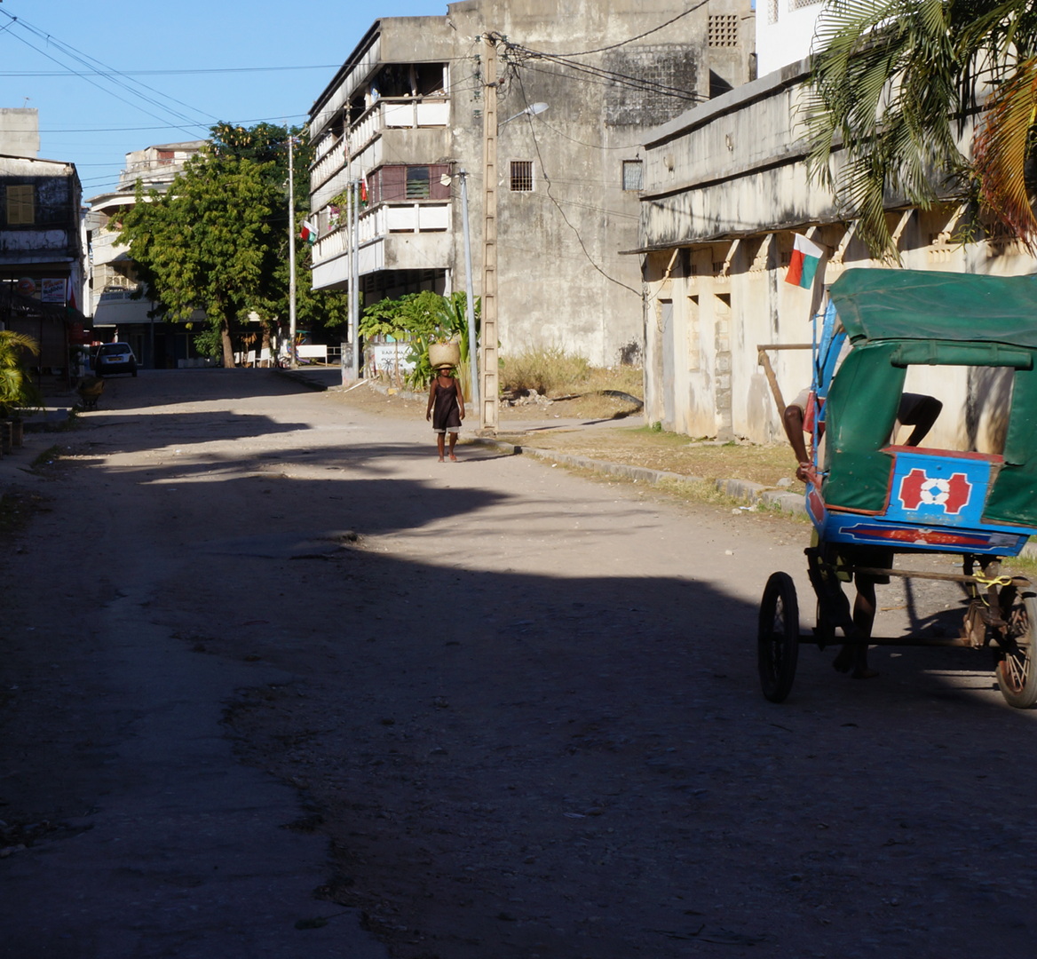 Street with woman and basket