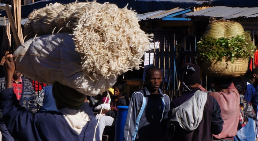 Carrying baskets on heads - morning market- Madagascar - Antananarivo